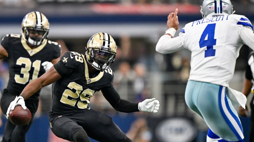 New Orleans Saints cornerback Paulson Adebo (29) runs with the ball after intercepting a pass by Dallas Cowboys quarterback Dak Prescott (4) during the first half of an NFL football game, Sunday, Sept. 15, 2024, in Arlington, Texas. (AP Photo/Jerome Miron)