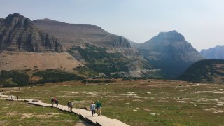 File – This Sept. 4, 2017, file photo, shows hikers in Glacier National Park in Montana.