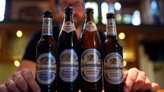 Head Brewmaster Tobias Zollo poses behind non alcoholic beer at the Weihenstephan brewery in Freising, Germany, Friday, Sept. 20, 2024.