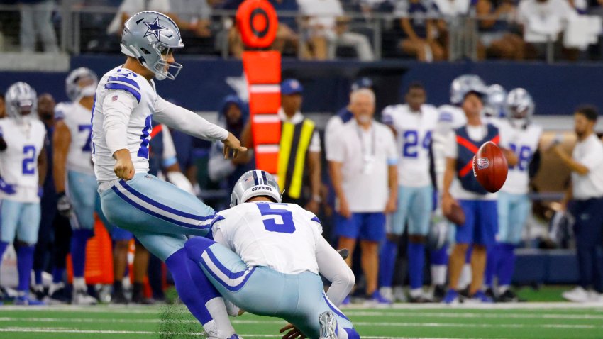 Dallas Cowboys place kicker Brandon Aubrey kicks a 65-yard field goal as punter Bryan Anger (5) holds in the first half of an NFL football game against the Baltimore Ravens in Arlington, Texas, Sunday, Sept. 22, 2024. (AP Photo/Gareth Patterson)