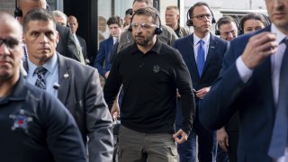 Ukrainian President Volodymyr Zelenskyy, center, tours the Scranton Army Ammunition Plant