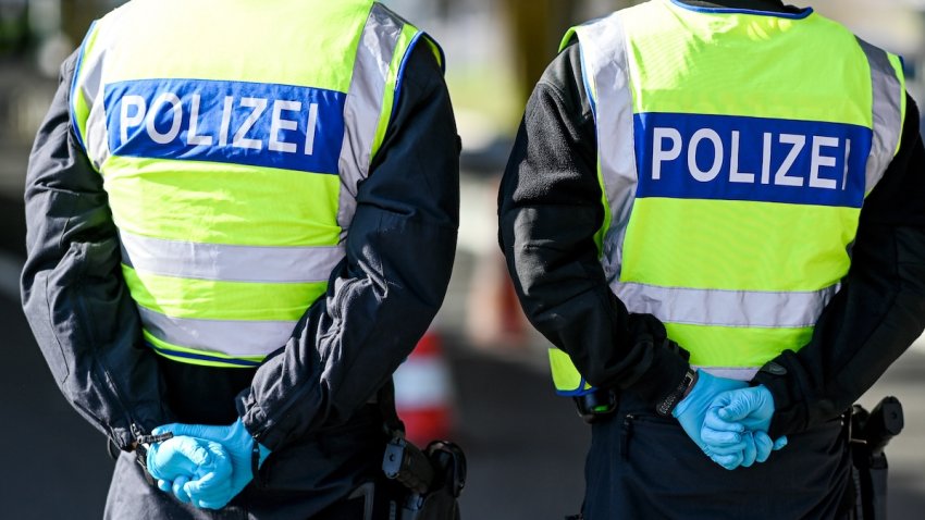 16 March 2020, Switzerland, Kreuzlingen: German policemen check people entering the country at the border crossing in Kreuzlingen. The German customs at the border crossing Konstanz/Kreuzlingen is on Swiss territory. Photo: Felix Kästle/dpa (Photo by Felix Kästle/picture alliance via Getty Images)