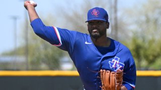 SURPRISE, ARIZONA – MARCH 25, 2023: Kumar Rocker #80 of the Texas Rangers throws a pitch during a minor league spring training game against the Kansas City Royals at Surprise Stadium on March 25, 2023 in Surprise, Arizona.