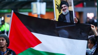 A portrait of Hassan Nasrallah is held up at a Pro-Palestine rally on October 10, 2023, in Melbourne, Australia.