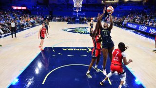 ARLINGTON, TX –  SEPTEMBER 3: Kalani Brown #21 of the Dallas Wings drives to the basket during the game against the Washington Mystics on September 3, 2024 at the College Park Center in Arlington, TX.