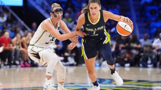 ARLINGTON, TEXAS – SEPTEMBER 10: Sevgi Uzun #1 of the Dallas Wings is defended by Courtney Vandersloot #22 of the New York Liberty during the second half at College Park Center on September 10, 2024 in Arlington, Texas. NOTE TO USER: User expressly acknowledges and agrees that, by downloading and or using this photograph, User is consenting to the terms and conditions of the Getty Images License Agreement.