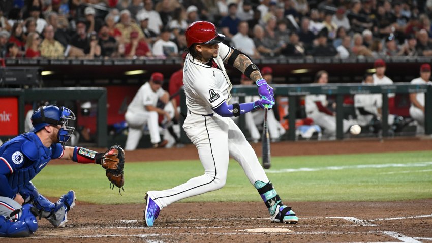 PHOENIX, ARIZONA – SEPTEMBER 11: Ketel Marte #4 of the Arizona Diamondbacks hits a three run home run against the Texas Rangers during the fourth inning at Chase Field on September 11, 2024 in Phoenix, Arizona.