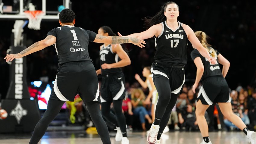 LAS VEGAS, NEVADA – SEPTEMBER 19: Kierstan Bell #1 and Megan Gustafson #17 of the Las Vegas Aces celebrate a score in the third quarter of a game against the Dallas Wings at Michelob ULTRA Arena on September 19, 2024 in Las Vegas, Nevada. NOTE TO USER: User expressly acknowledges and agrees that, by downloading and or using this photograph, User is consenting to the terms and conditions of the Getty Images License Agreement. Aces defeat the Wings 98-84. (Photo by Louis Grasse/Getty Images)