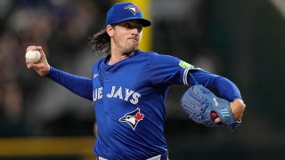 Toronto Blue Jays starting pitcher Kevin Gausman throws to the Texas Rangers in the first inning of a baseball game in Arlington, Texas, Thursday, Sept. 19, 2024.