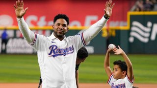 Sep 6, 2024; Arlington, Texas, USA; Former Texas Ranger Elvis Andres waves to fans after his son Elvis threw out the first pitch before the game between the Texas Rangers and the Los Angeles Angels at Globe Life Field. Andrus retired as a Texas Ranger after playing the first 12 seasons of his 15-year Major League career in Arlington. (Mandatory Credit: Raymond Carlin III-Imagn Images)