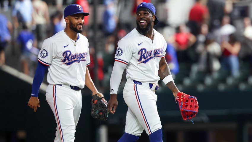 Sep 18, 2024; Arlington, Texas, USA;  Texas Rangers right fielder Adolis Garcia (53) celebrates with Texas Rangers second baseman Marcus Semien (2) after the game against the Toronto Blue Jays at Globe Life Field. (Mandatory Credit: Kevin Jairaj-Imagn Images)