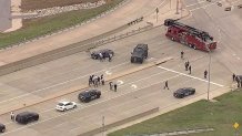 Officials with the Johnson County Sheriff's Office, Texas DPS, and Mansfield Police Department investigate a chase that ended with a suicide on the Broad Street Bridge, Monday, Sept. 23, 2024.