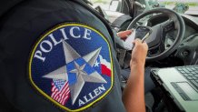 Allen police officer Andrew Rembert writes a speeding ticket along U.S. Highway 75/Central Expressway.