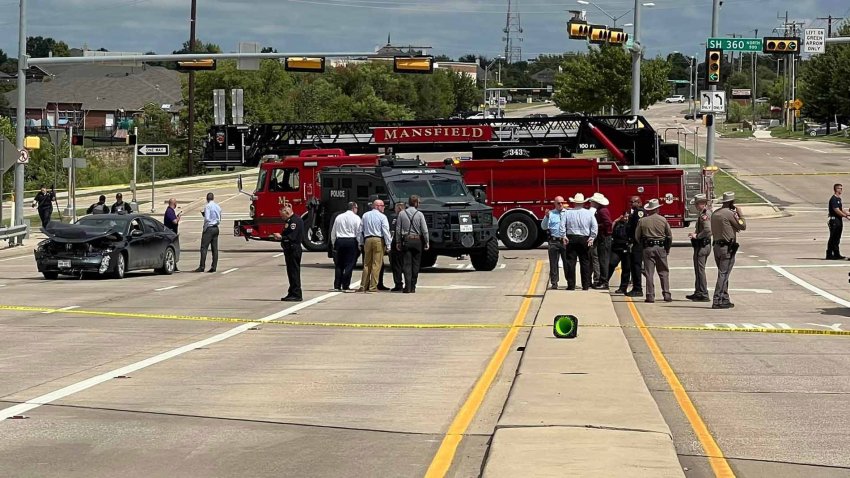 Officials with the Johnson County Sheriff’s Office, Texas DPS, and Mansfield Police Department investigate a chase that ended with a suicide on the Broad Street Bridge, Monday, Sept. 23, 2024.