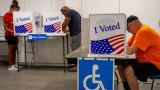 People vote on the first day of Virginia’s in-person early voting at Long Bridge Park Aquatics and Fitness Center on September 20, 2024 in Arlington, Virginia. 