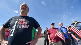 A Trump supporter watches an anti-Trump demonstration in Wilkes-Barre, Pennsylvania.