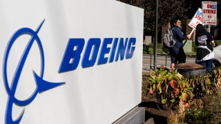 Workers picket outside the Boeing Co. manufacturing facility during a strike in Renton, Washington, US, on Thursday, Oct. 3, 2024. 