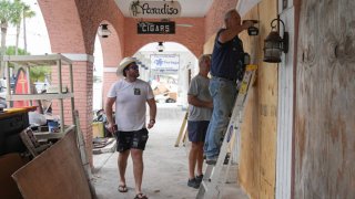 Residents board up a store in the Pass-A-Grille section of St. Petersburg ahead of Hurricane Milton’s expected landfall in the middle of this week in Florida on October 7, 2024.