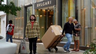 Shoppers make their way through the Miami Design District featuring stores from many luxury fashion names on December 14, 2023 in Miami, Florida. 