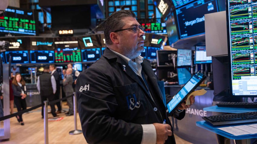 Traders work on the New York Stock Exchange floor on Oct. 16, 2024.