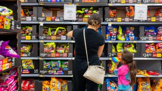 A family shops for Halloween candy at a Walmart Supercenter on October 16, 2024 in Austin, Texas. 