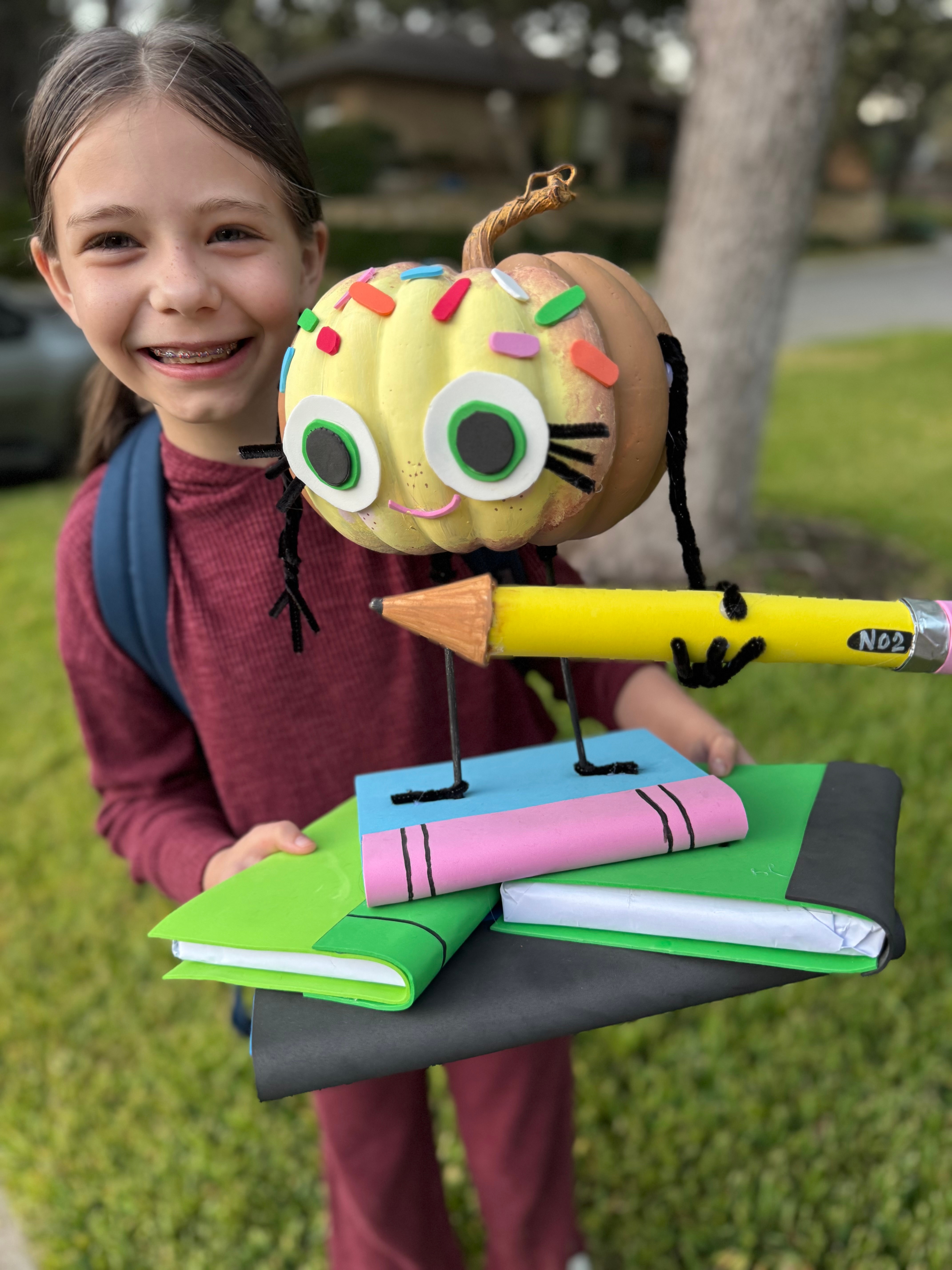 Korbyn with her storybook pumpkin “The Smart Cookie”