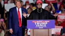 Nicky Jam speaks as Republican presidential nominee former President Donald Trump listens during a campaign event at the World Market Center, Friday, Sept.13, 2024, in Las Vegas. (AP Photo/John Locher)