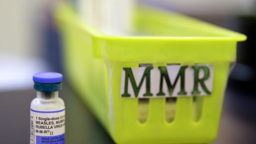 FILE – A vial of a measles, mumps and rubella vaccine sits on a countertop at a pediatrics clinic in Greenbrae, Calif., on Feb. 6, 2015.