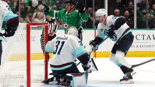 Dallas Stars center Sam Steel (18) reacts after scoring against Seattle Kraken goaltender Philipp Grubauer (31) and defenseman Will Borgen (3) in the first period during an NHL hockey game Sunday, Oct. 13, 2024, in Dallas. (AP Photo/Richard W. Rodriguez)