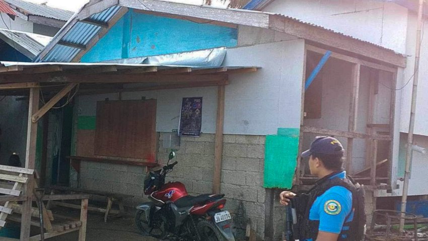 A policeman checks an area Friday Oct. 18, 2024, where an American identified as Elliot Onil Eastman, from Vermont, was reportedly abducted by gunmen in Sibuco town, Zamboanga del Norte province, southern Philippines.