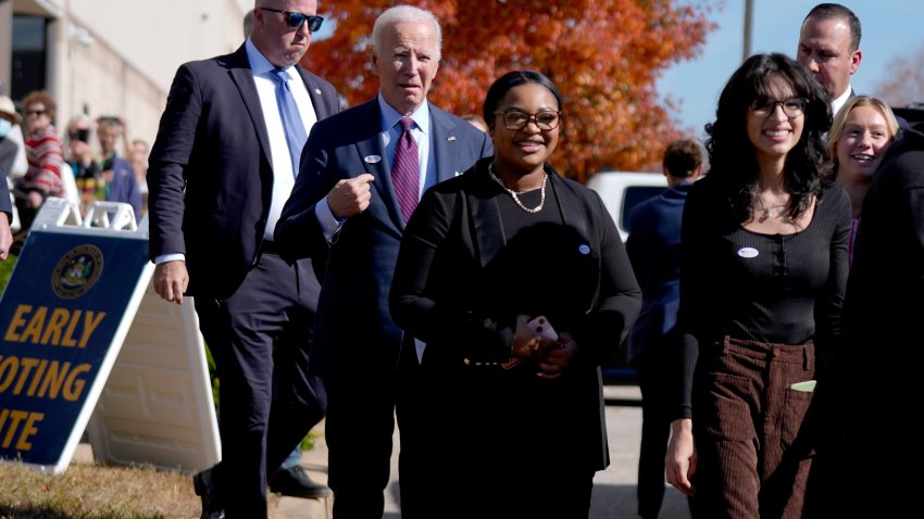 President Joe Biden, second left, departs a polling station alongside first-time voters after casting his early-voting ballot for the 2024 general elections, Monday, Oct. 28, 2024, in New Castle, Delaware.