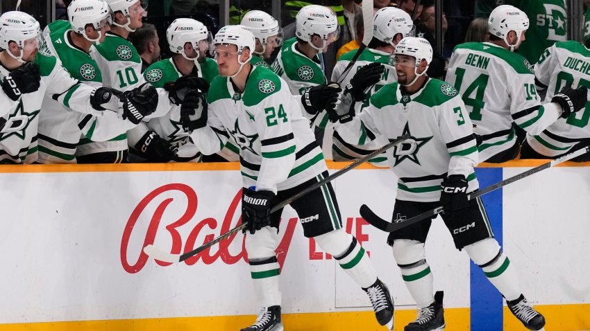 Dallas Stars center Roope Hintz (24) celebrates his goal with teammates during the second period of an NHL hockey game against the Nashville Predators, Thursday, Oct. 10, 2024, in Nashville, Tenn. (AP Photo/George Walker IV)