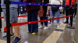 Voters wait in line on the first day of early voting in New York on Oct. 26, 2024.