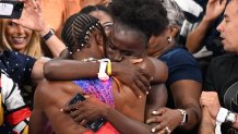 Noah Lyles celebrates with Junelle Bromfield