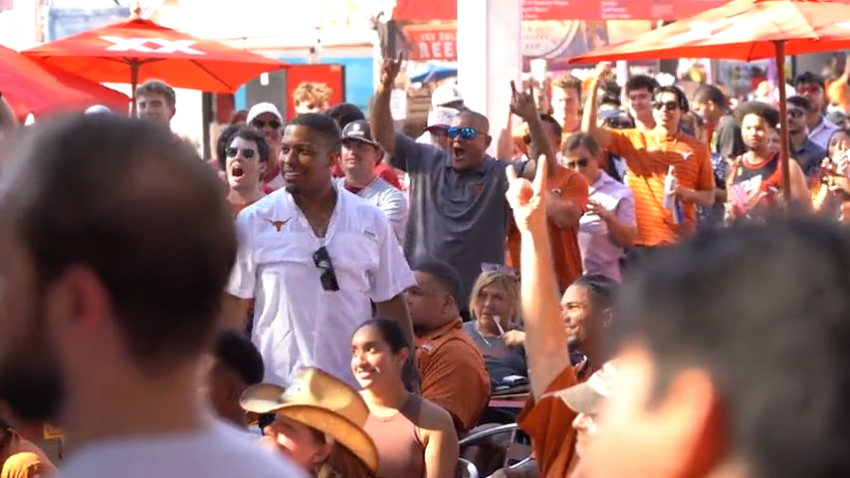 Texas fans cheer at a watch party at the fairgrounds during the Red River Showdown.