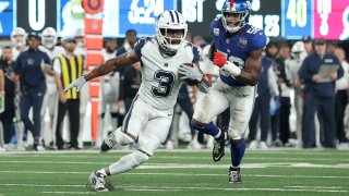 Sep 26, 2024; East Rutherford, New Jersey, USA; Dallas Cowboys wide receiver Brandin Cooks (3) runs with the ball against New York Giants linebacker Bobby Okereke (58) during the first quarter at MetLife Stadium.