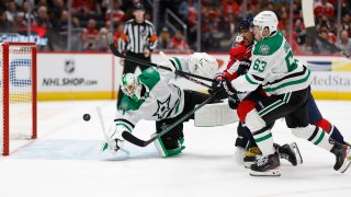 Oct 17, 2024; Washington, District of Columbia, USA; Washington Capitals left wing Alex Ovechkin (8) and Dallas Stars right wing Evgenii Dadonov (63) battles for the puck in front of Stars goaltender Casey DeSmith (1) in the third period at Capital One Arena. (Mandatory Credit: Geoff Burke-Imagn Images)