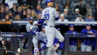 Oct 28, 2024; New York, New York, USA; Los Angeles Dodgers shortstop Mookie Betts (50) hits an RBI single during the third inning against the New York Yankees in game three of the 2024 MLB World Series at Yankee Stadium. Mandatory Credit: Brad Penner-Imagn Images