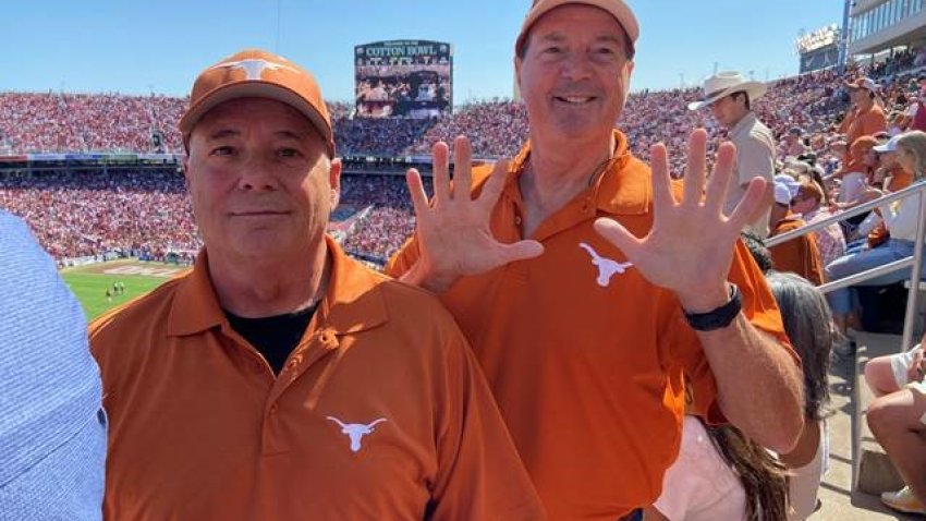 Battle (right) at game number 55 with his brother Jerry in 2023. He has been attending the Texas Oklahoma game in person since 1969.