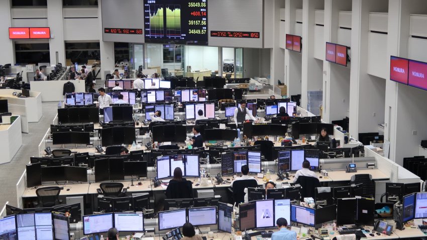 A screen displays the Nikkei 225 Stock Average figure on the trading floor at the Nomura Securities Co. headquarters in Tokyo, Japan, on Jan. 11, 2024. 