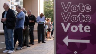 A voter works on his ballot at a polling station at theElena Bozeman Government Center in Arlington, Virginia, on September 20, 2024. Early in-person voting for the 2024 US presidential election began in Virginia, South Dakota and Minnesota. 