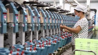 A worker is making textile export orders at a production workshop of a textile enterprise in Binzhou, China, on July 8, 2024.