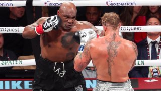 Mike Tyson (black gloves) fights Jake Paul (silver gloves) at AT&T Stadium in Arlington, Texas, on Nov. 15, 2024.