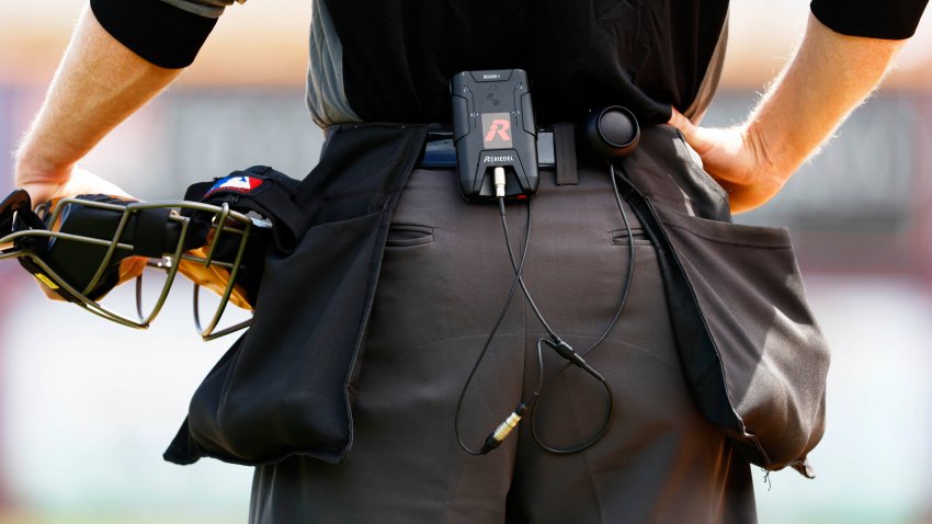 A transmitter and receiver on the belt of Home Plate Umpire Brian Walsh