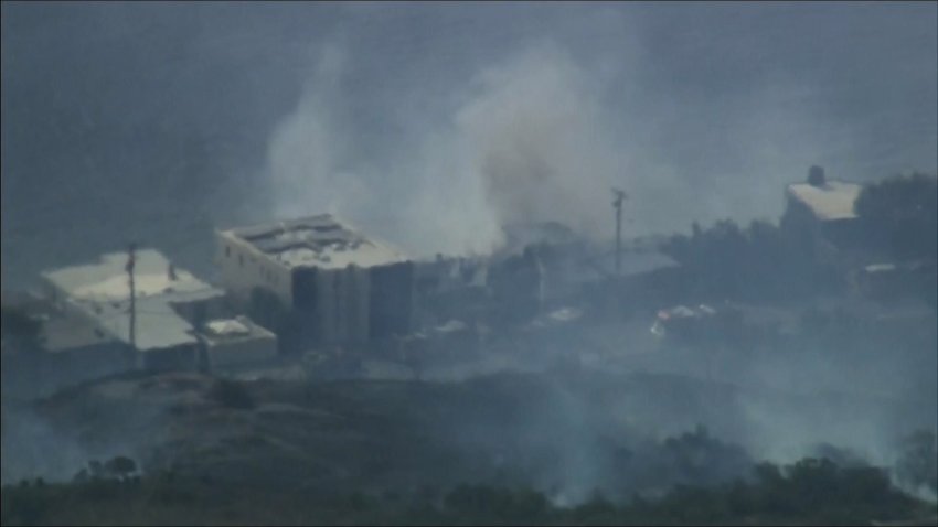 A building on fire in Malibu