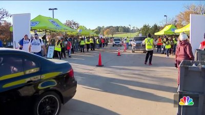 Hundreds turn out for Thanksgiving dinner giveaways Saturday