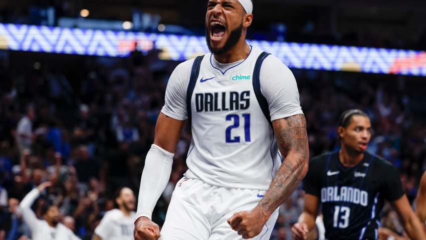 Dallas Mavericks center Daniel Gafford (21) celebrates after dunking during the first half of an NBA basketball game against the Orlando Magic, Sunday, Nov. 3, 2024, in Dallas. (AP Photo/Gareth Patterson)