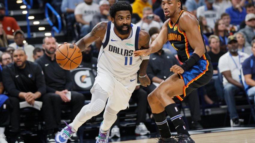 Dallas Mavericks guard Kyrie Irving (11) drives against Oklahoma City Thunder guard Aaron Wiggins, right, during the first half of an NBA basketball game Sunday, Nov. 17, 2024, in Oklahoma City. (AP Photo/Nate Billings)