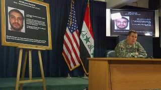 File - Brig. Gen. Kevin J. Bergner on July 2, 2007, as a picture of Ali Mussa Daqduq is displayed in the heavily fortified Green Zone area in Baghdad.