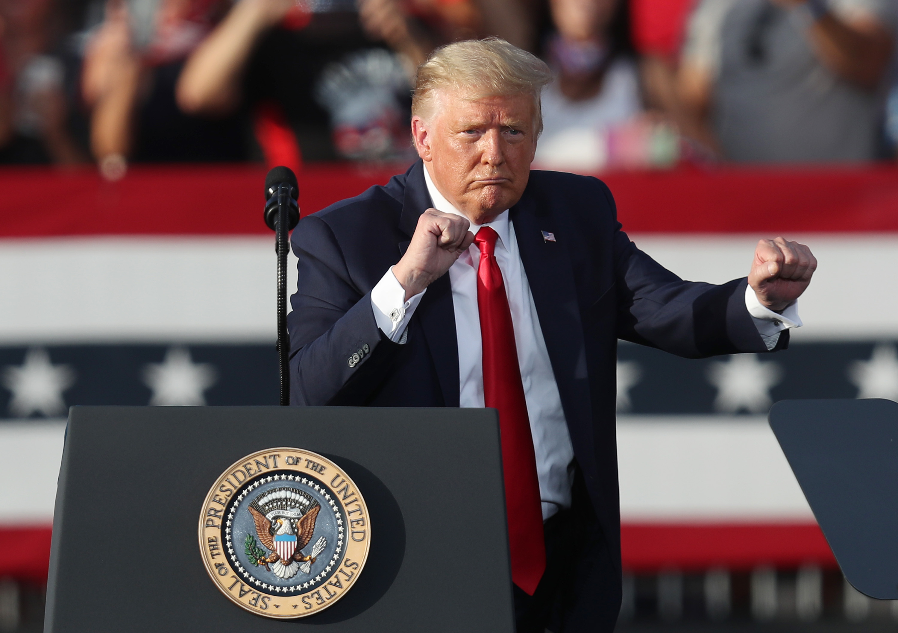 File. President Donald Trump dances to the music after speaking during his campaign event at The Villages Polo Club on October 23, 2020 in The Villages, Florida. President Trump continues to campaign against Democratic presidential nominee Joe Biden leading up to the November 3rd Election Day.